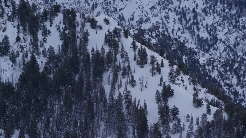 An aerial view of a high snowy mountain ridge