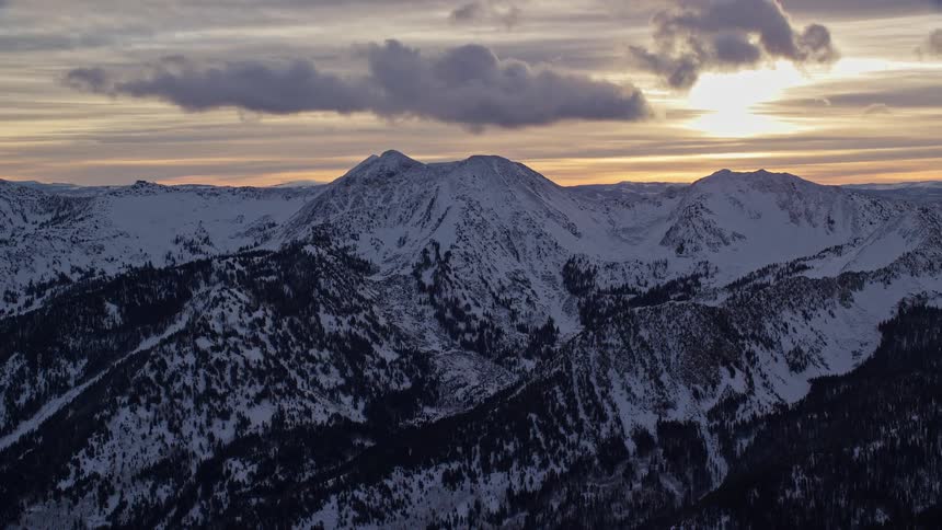 The sun is rising on the mountains