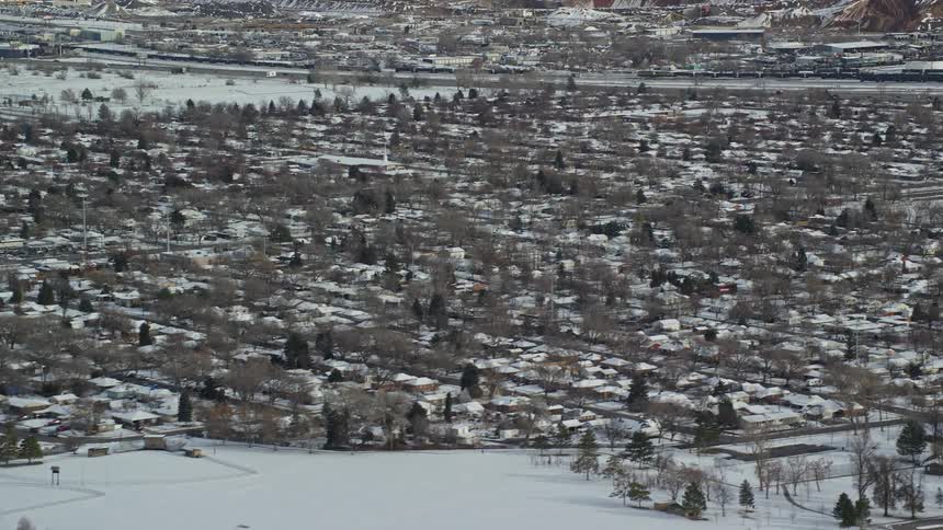 Aerial view of snowy suburban area
