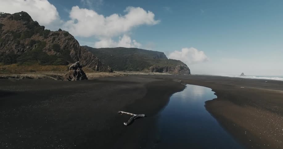 A mountain is by the shore