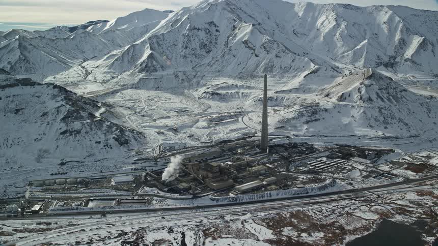 A manufacturing plant is near the mountain