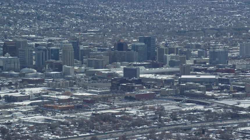 The city is covered in snow on the horizon