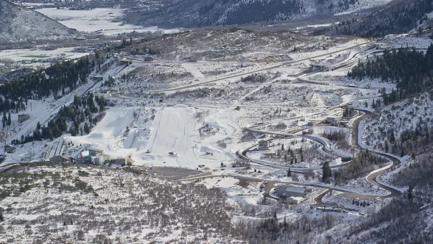 Aerial of a winter resort with ski slope during the day