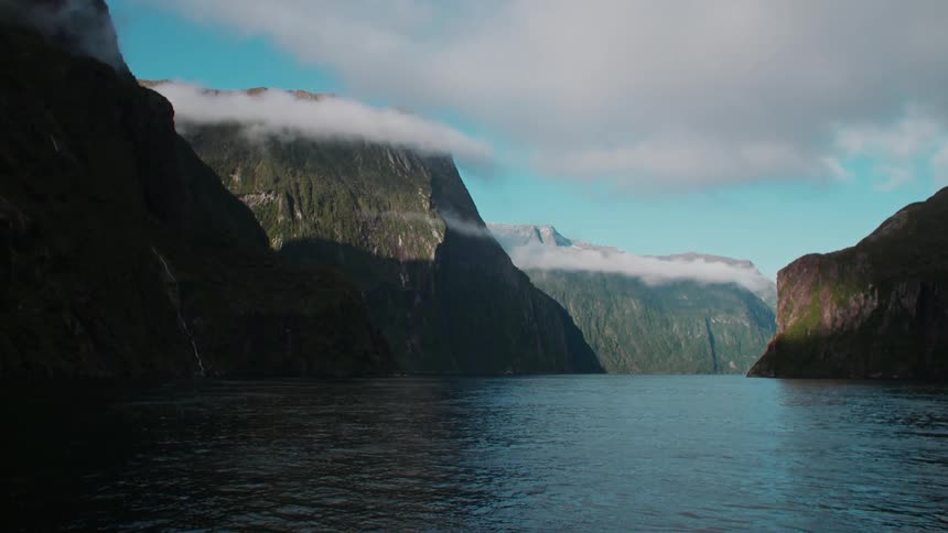 The sea is surrounded by mountain ranges on sunny days