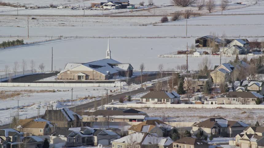 Aerial of a rural town covered in snow during winter