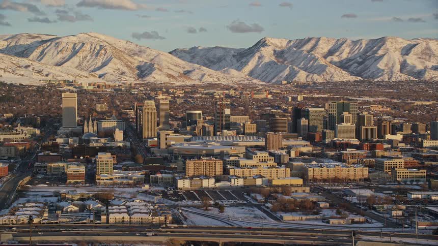 Aerial of an urban city with highway with heavy traffic during winter day