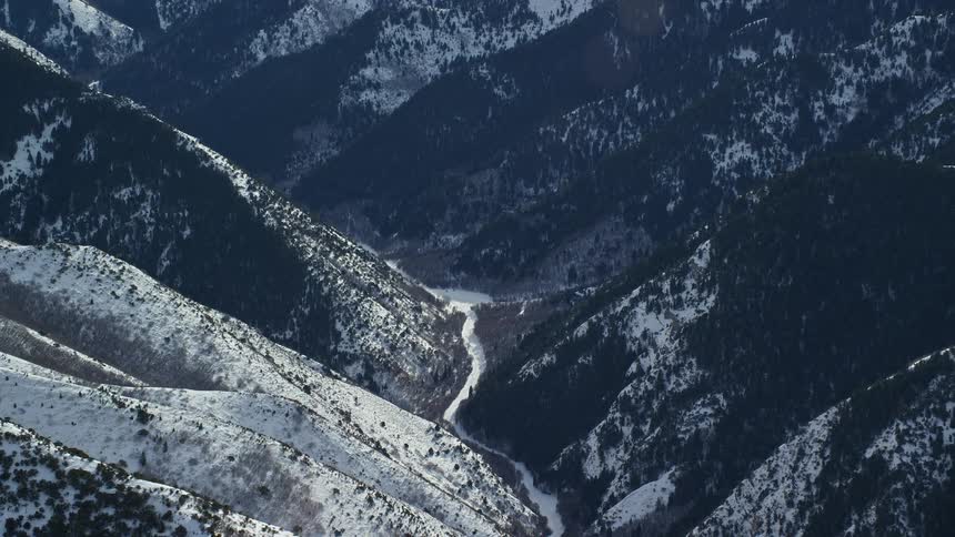 Aerial view of snowy mountains and a valley