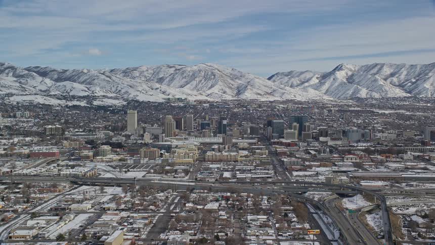 Aerial of city with busy highways during winter