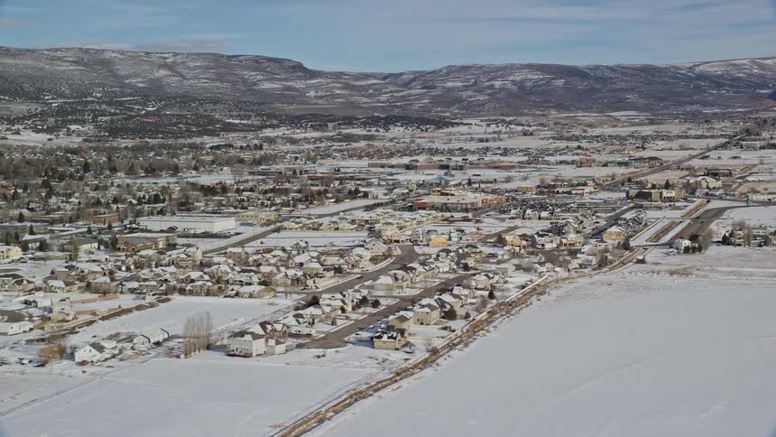 The homes in the suburbs are covered with snow