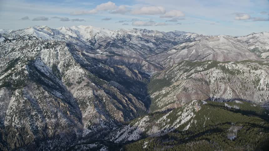 Aerial view of snowy mountains and a valley