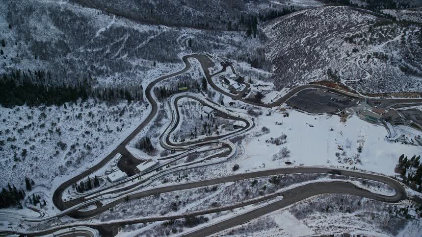Aerial of a running track on a snowcovered mountain