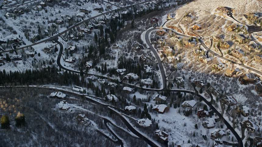 The snow covered town is on the mountains