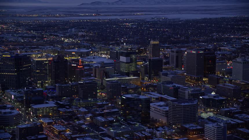 Skyline of a snowy urban city illuminated at night