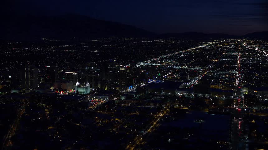 Aerial panorama of a metropolis with the city illuminated at night