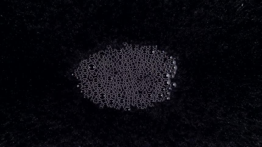 Time lapse of air bubbles forming on the surface of water