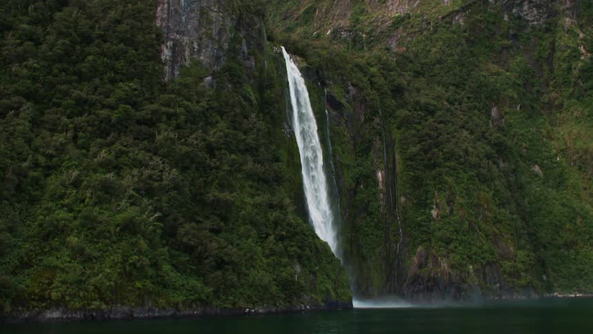 Stirling falls a majestic waterfall in milford sound new zealand cascades down a rugged cliff