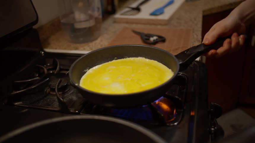 Omelette being prepared in a frying pan