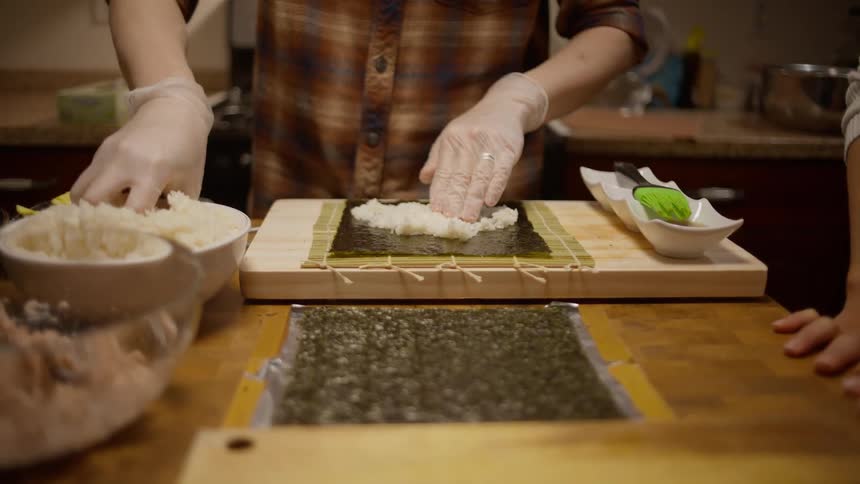 A person preparing a Korean meal for dinner