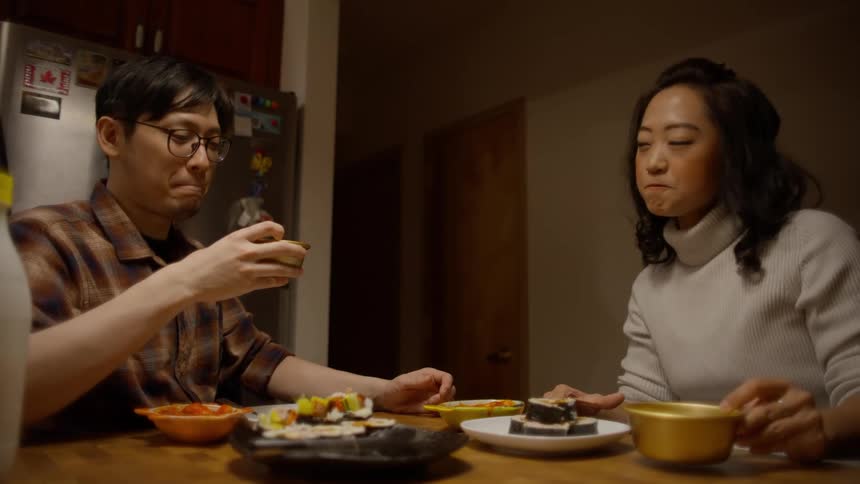 Young asian couple having a meal at home