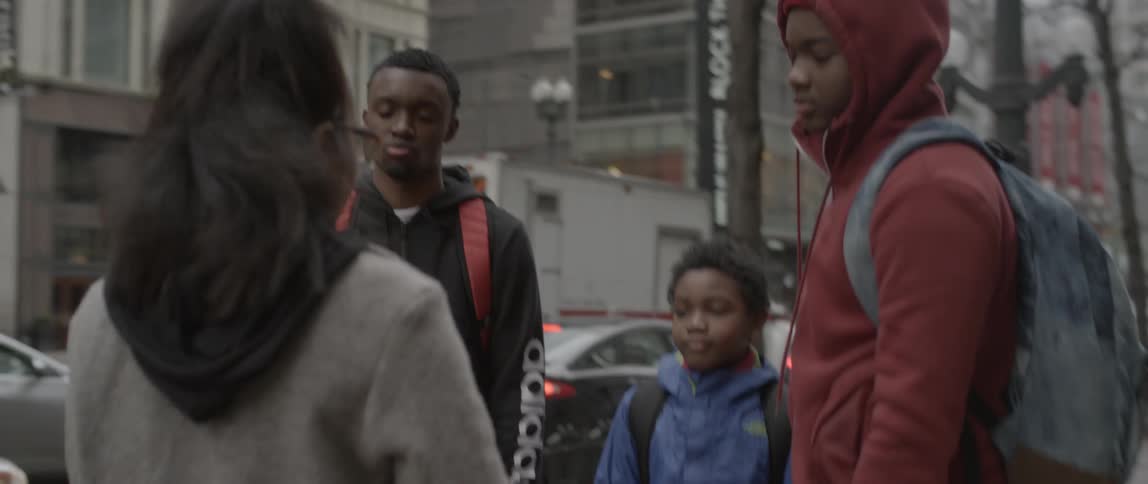Young woman gets ready to interview three young men