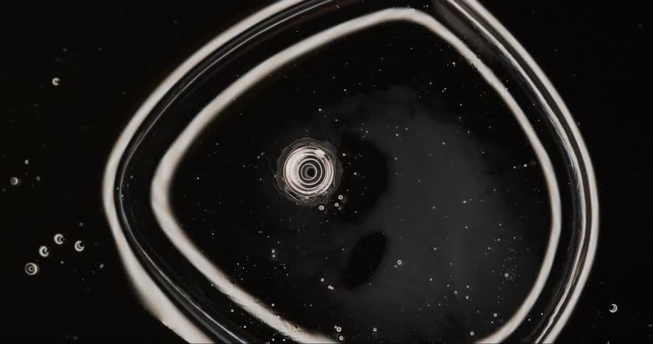 Extreme closeup of a dense water bubble in slow motion
