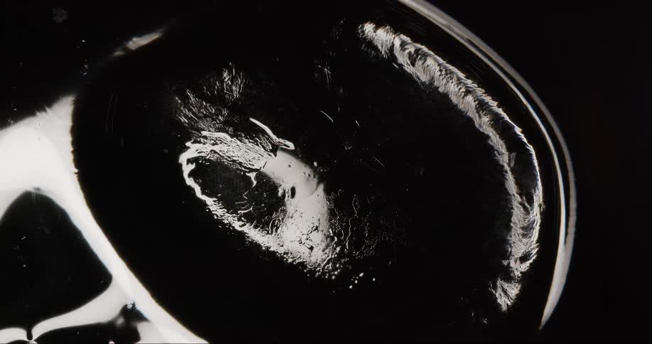Extreme closeup of abstract dense liquid in motion
