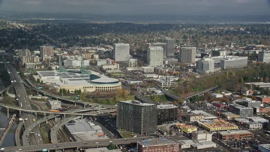Traffic runs on the freeway by the city