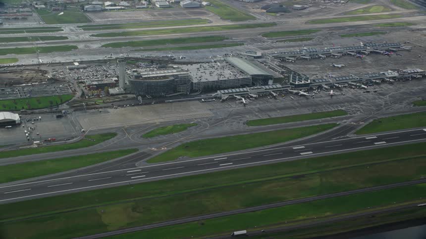 Aerial panorama of an airport by a lake
