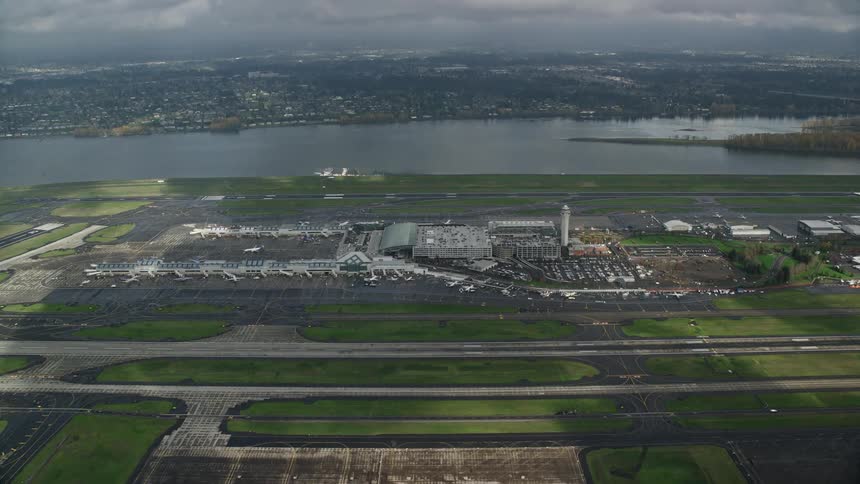 Lake separates city from airfields and airport on an overcast day