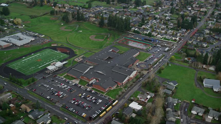 Aerial panorama of an urban city with stadiums and fields