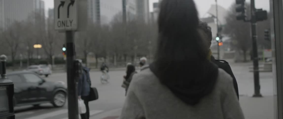 A woman stops another woman to take a photo of her