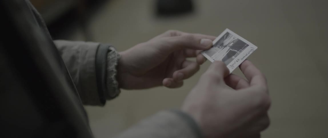 A person is holding a photograph