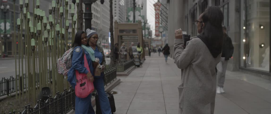 Two women have their photographs taken