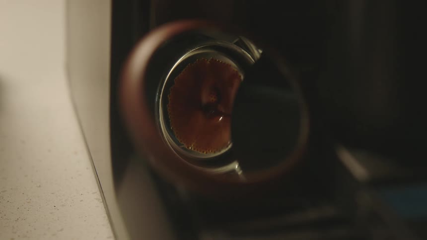 A brown liquid is filling into an object