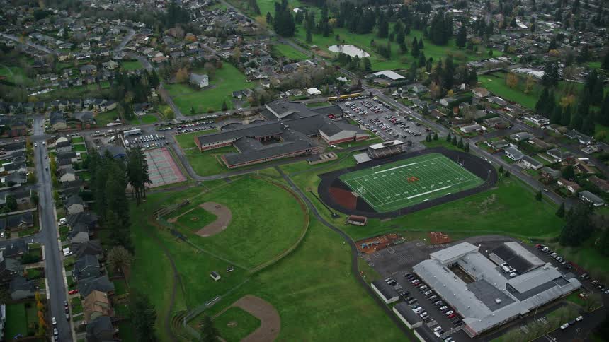 Aerial of sports courts in a residential neighborhood during the day