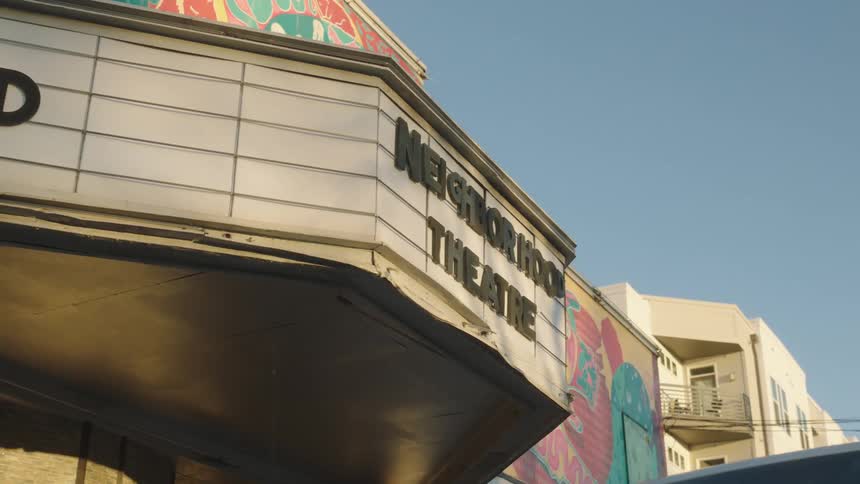 The sky is clear over the movie theatre