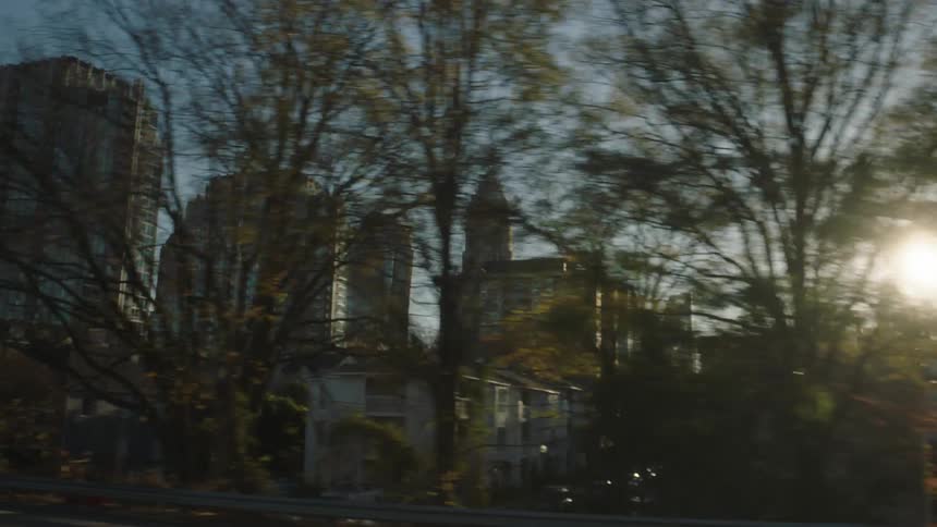 Apartment buildings are on the side of the road
