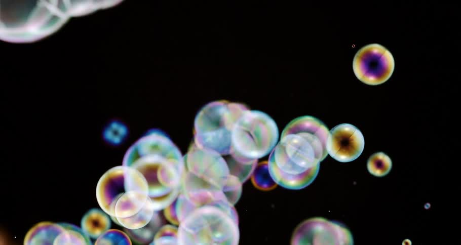 Closeup of colorful bubbles in slow motion