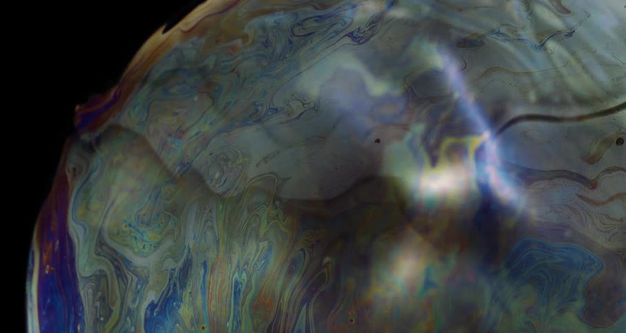 Abstract liquid paint in a reflective liquid