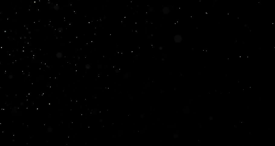 Extreme closeup on a soap bubble bursting on a black background in slow motion