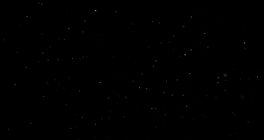 Extreme closeup of a dense liquid dissipating on a black and abstract background