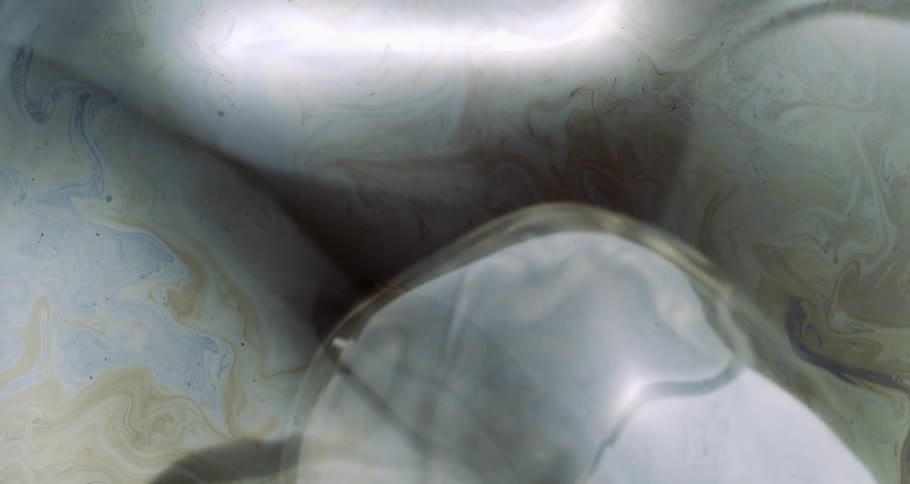 Microscopic view of a soap bubble in slow motion