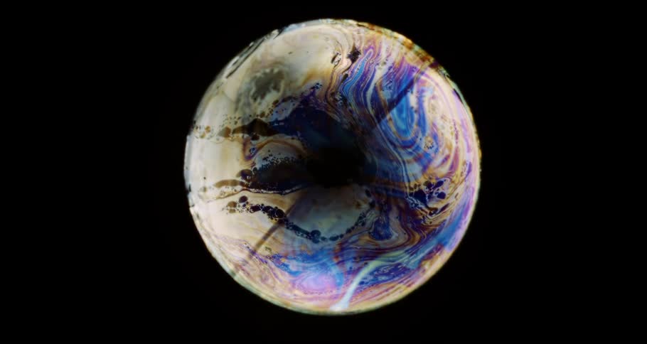 Liquid colorful bubble with patterns on a black background
