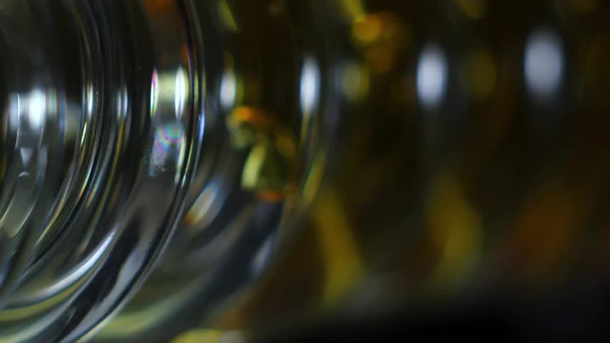 Yellow liquid fills the glass coil