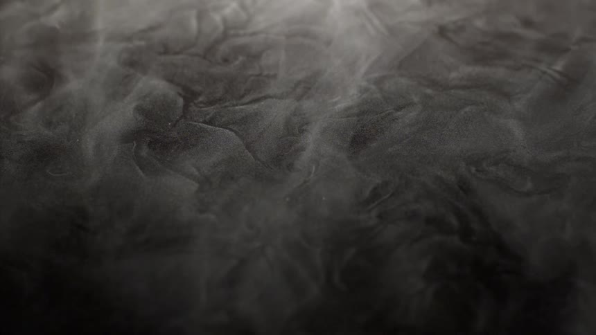 A smoke that is in the air and on the ground with texture