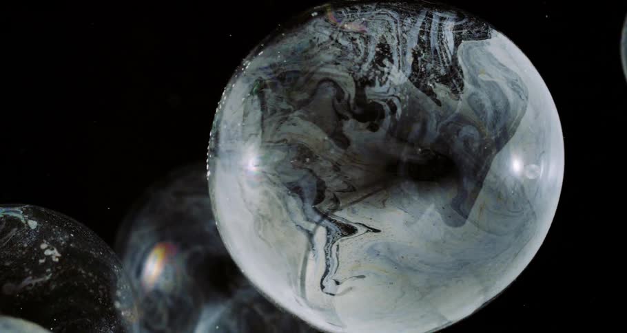 Extreme closeup of dense and liquid bubbles in slow motion