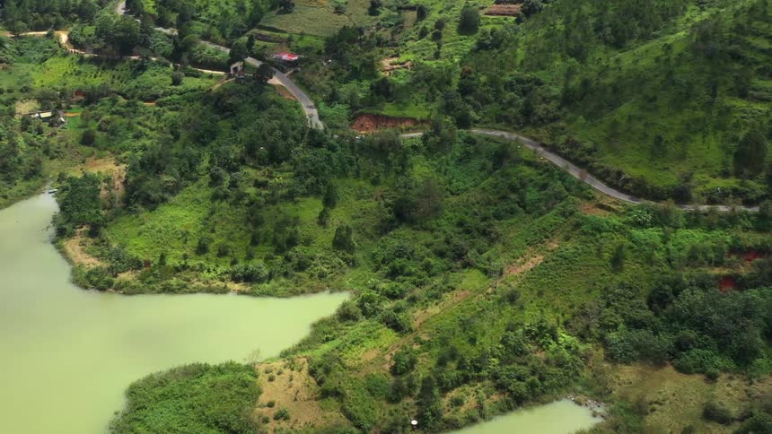 Aerial panorama of mountains and a greenish lake