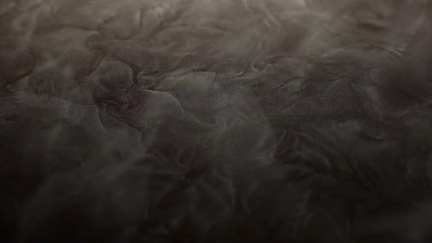 Smoke passing in slow motion above brown soil