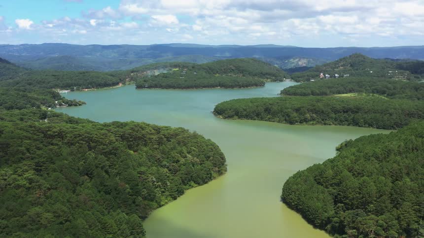 A river connected with a lake and several islands of tree forests
