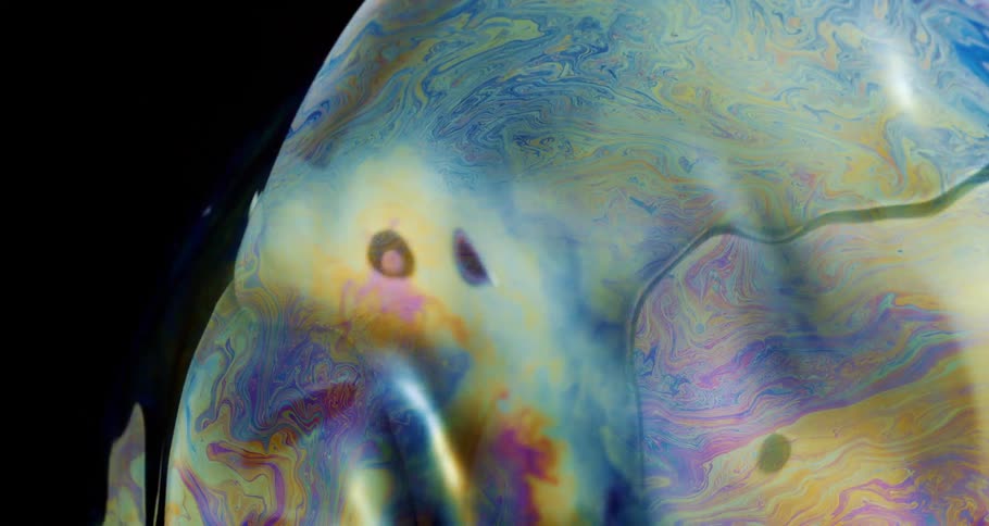 Abstract paint under a dense liquid in slow motion